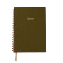 Green planner with '2026-2027' on a white background