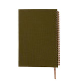 Green notebook with a spiral binding on a white background