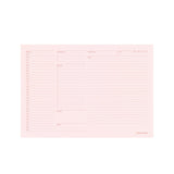 Pink planner insert with columns and text on a white background