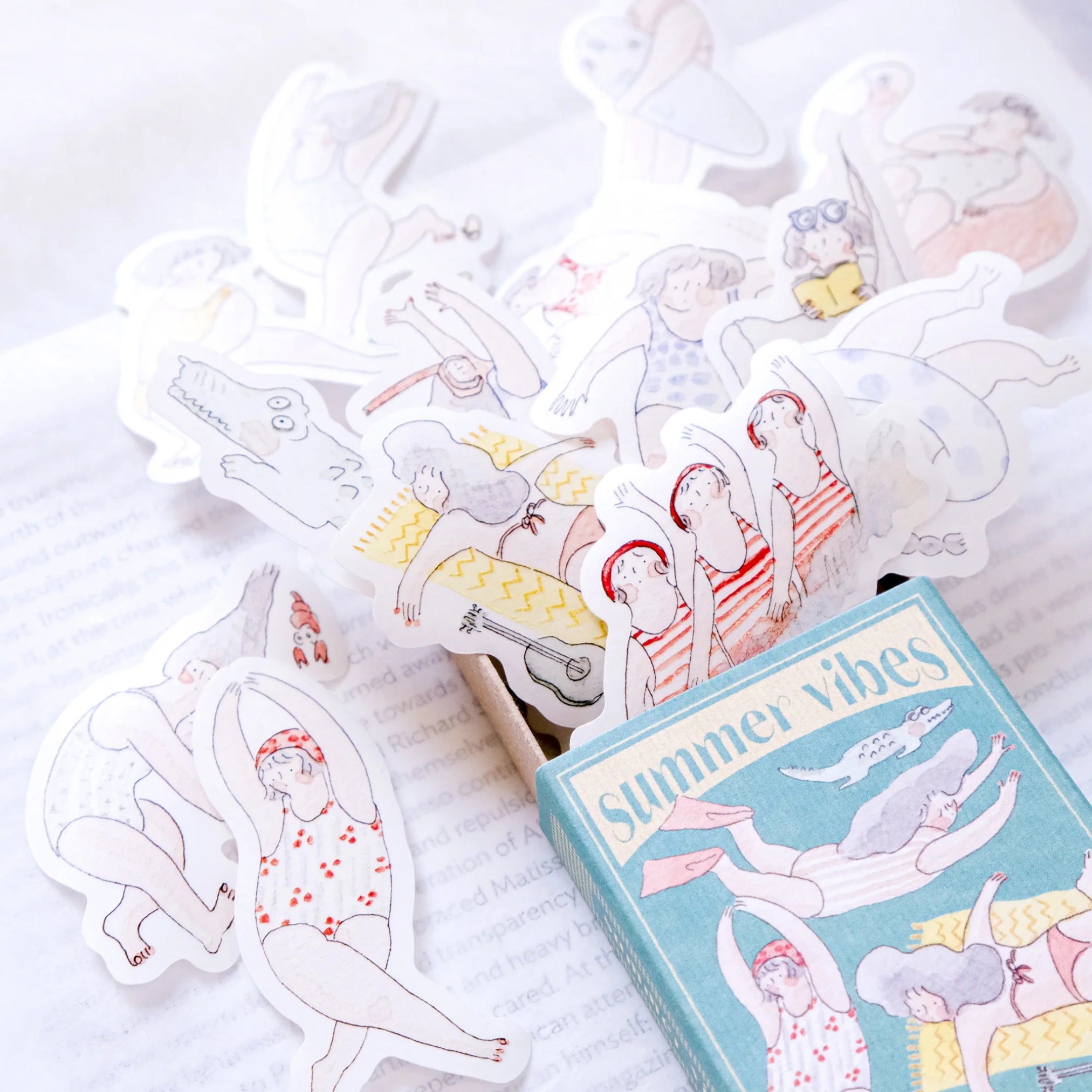 matchbox of stickers with summer illustrations