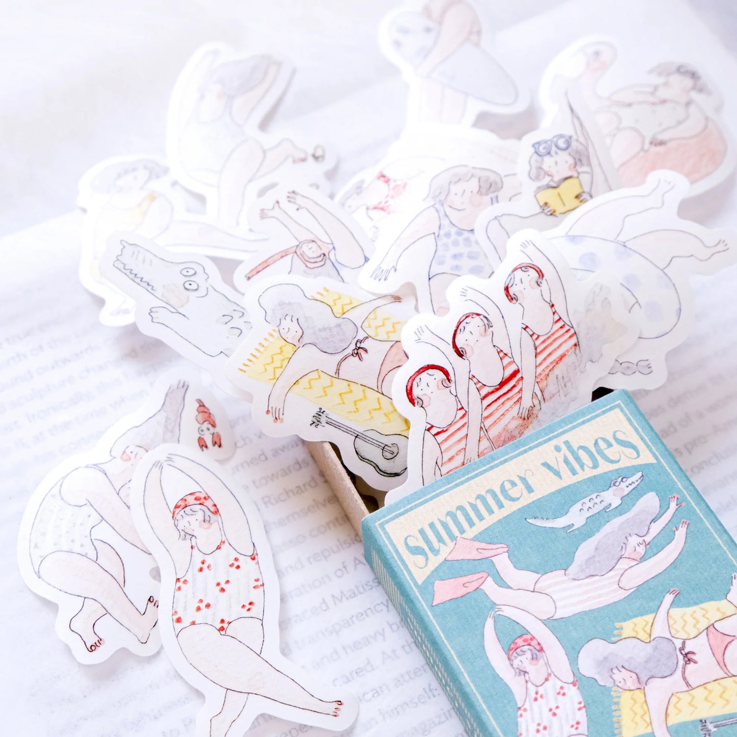 matchbox of stickers with summer illustrations