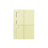 A buttermilk yellow pocket-sized planner with days of the week on each page, including a removable pocket as a page marker and a smooth cover.