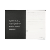 planning goals journal in sand