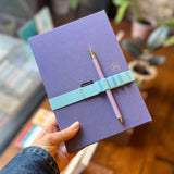 Purple luxury ruled notebook with pen and band