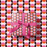 Seventies Wrapping Paper with geometric circular design and retro pink, orange and brown colours. 