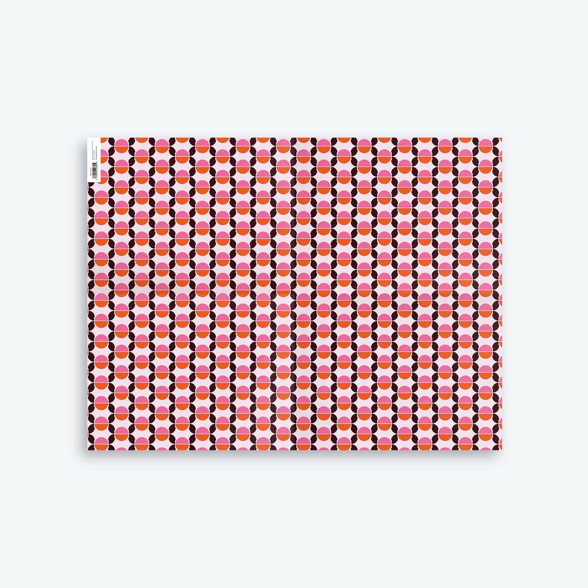 Seventies Wrapping Paper with geometric circular design and retro pink, orange and brown colours. 
