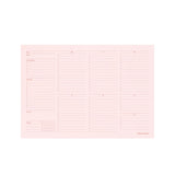 Pink planner insert with grid layout on a white background
