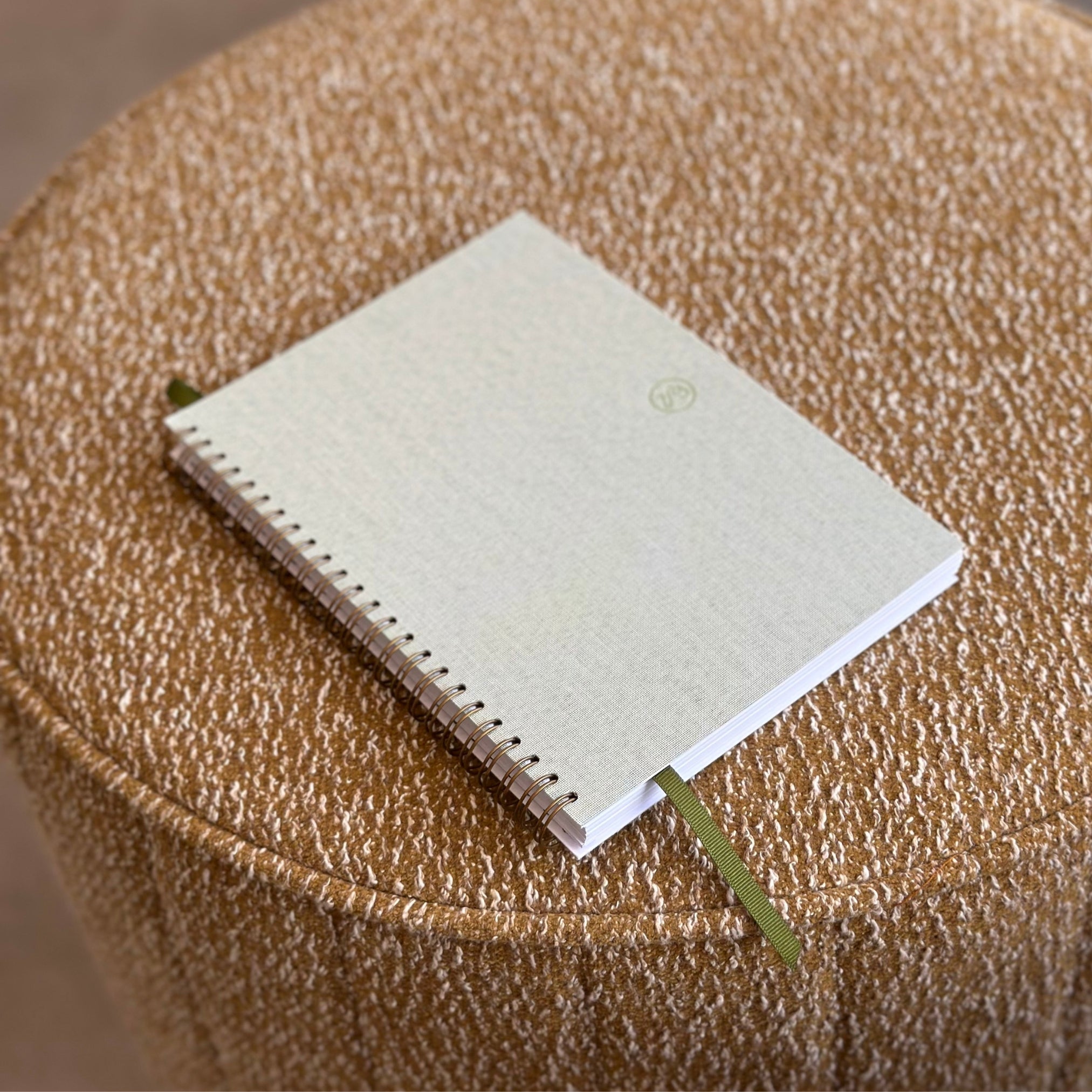 Small notebook on a textured brown surface
