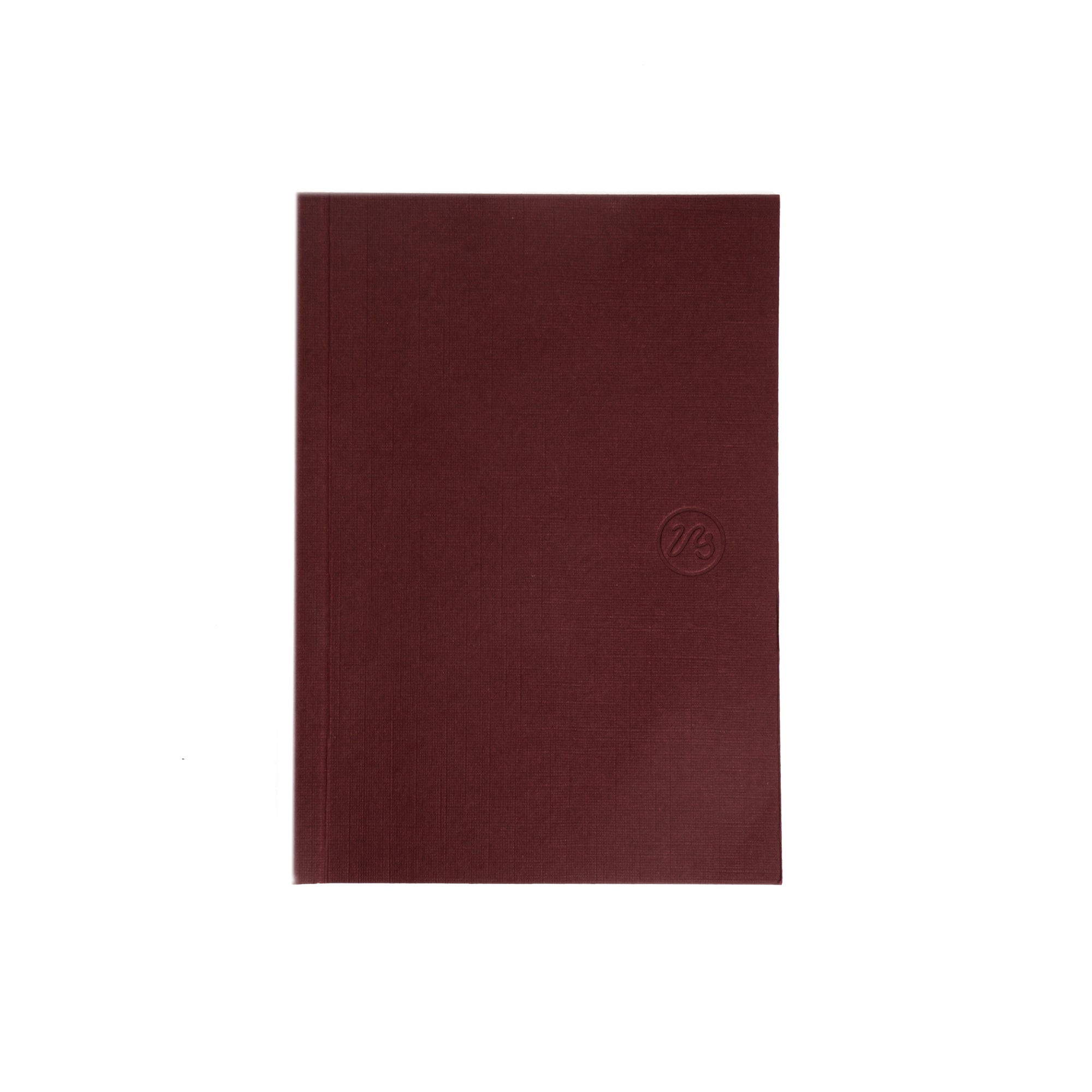 Burgundy pocket sized notebook on a white background