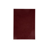 Burgundy pocket sized notebook on a white background
