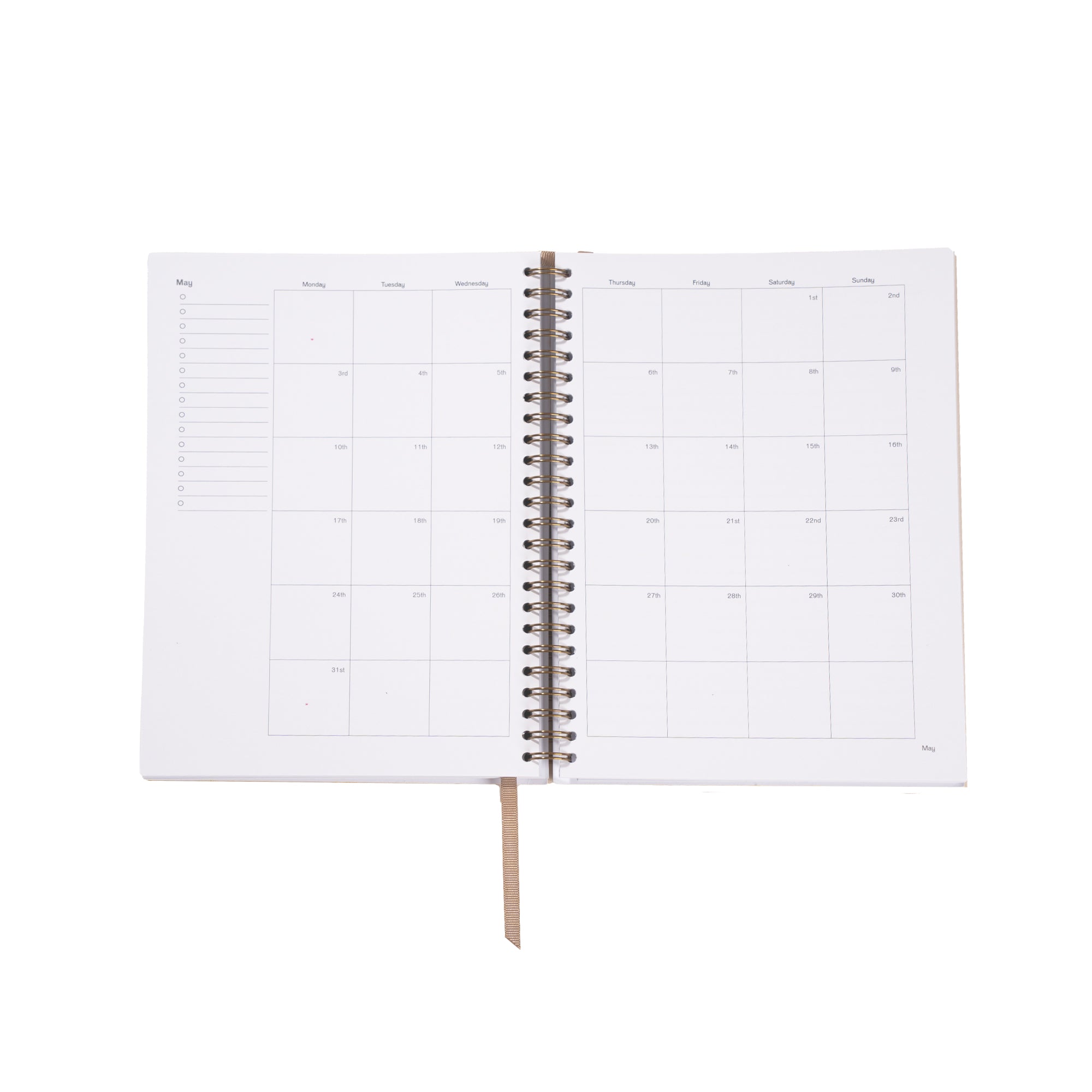 Open spiral-bound planner with grid layout on white background