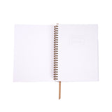 White spiral-bound notebook on a white background