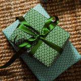 Olive green recycled plastic ribbon tied on present