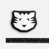 Black and white tiger face design on a white background with a ruler for scale.