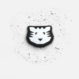 Black and white tiger face design on a textured white background