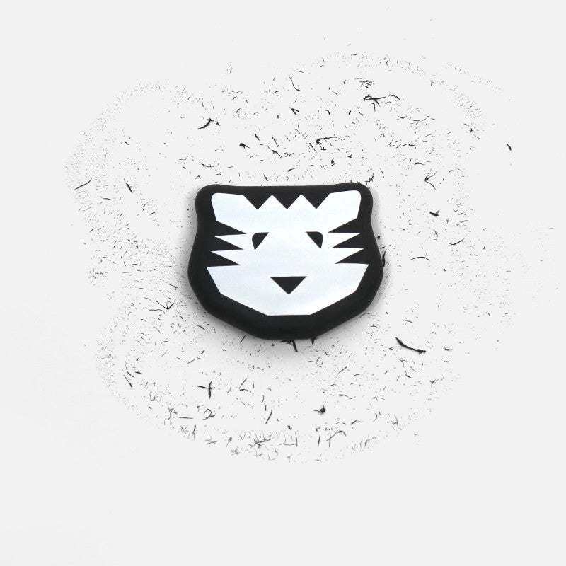Black and white tiger face design on a textured white background