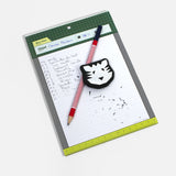 Notebook with a pen and eraser on a white background