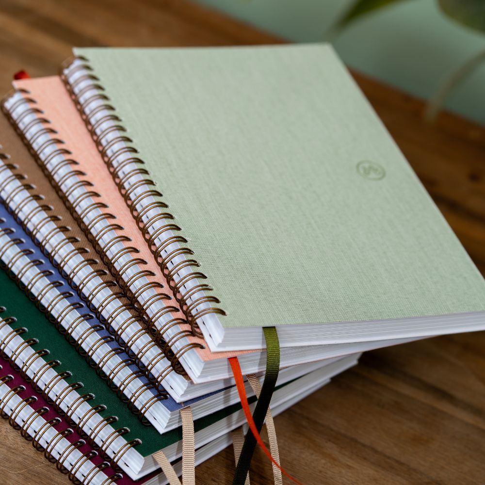 Spiral-bound notebook stack